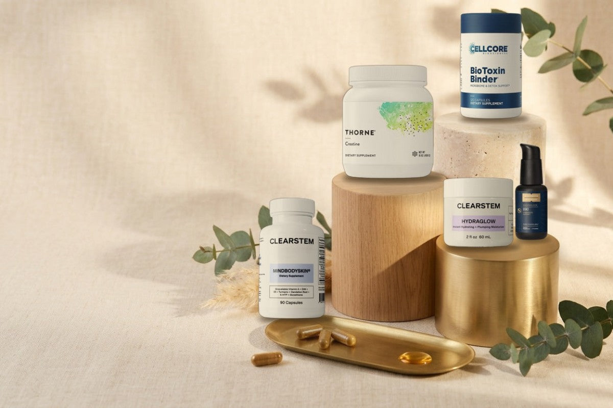 RADDHealth best sellers BioToxin Binder, Thorne Creatine, CLEARSTEM HYDRAGLOW, Quicksilver D3K2 and MINDBODYSKIN on wood, travertine and gold pedestals
